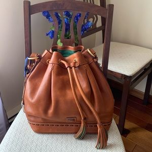 Gorgeous NWT Tan Dorney Bourke crossbody Drawstring satchel with Brass Accents.